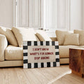 Funny dinner quote artwork with black block border displayed before cream living room sofa