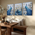 Three blue peacock and white flower prints above wooden dining bench and table with cups and pastries