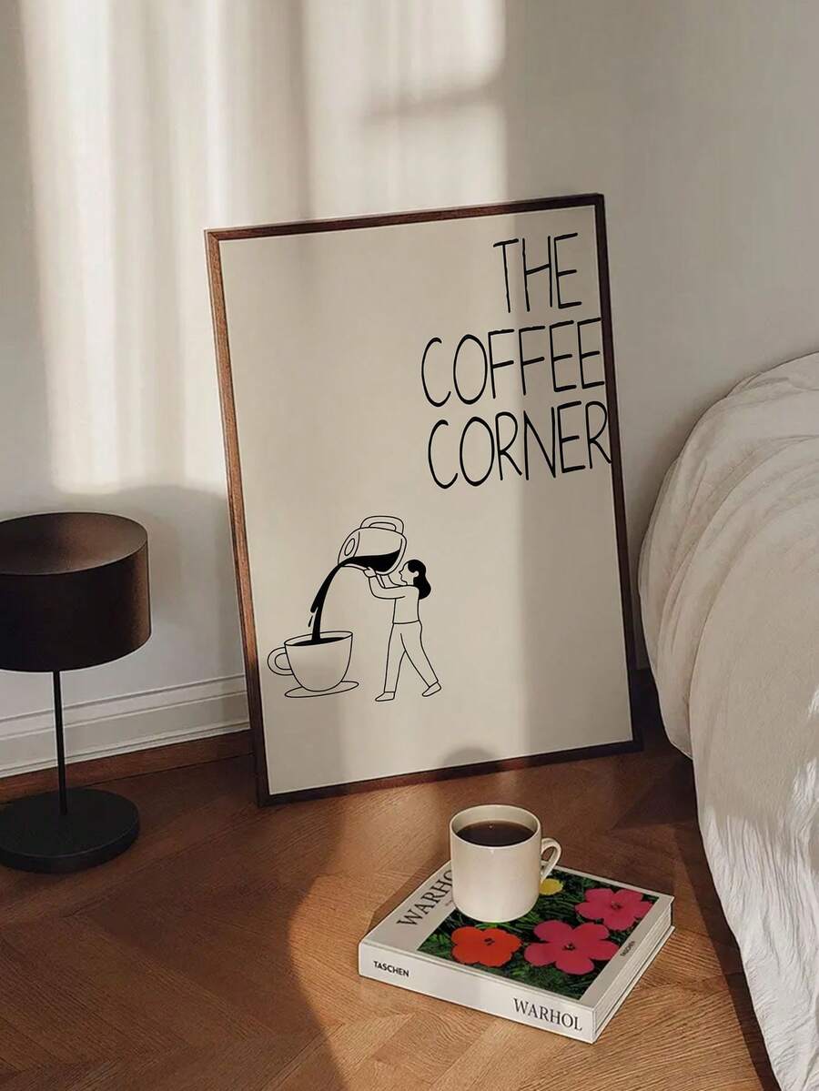 Dark wood framed coffee corner poster beside bed with lamp coffee cup and book
