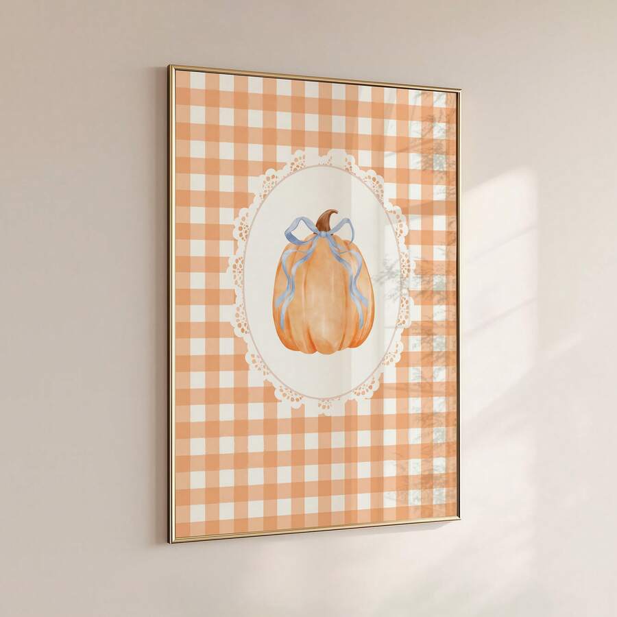 Wall-mounted gingham pumpkin artwork in slim metallic frame