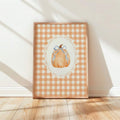 Watercolor pumpkin and blue bow canvas in sunlit wood frame