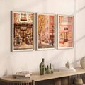 Cozy three-piece storefront art above pale wood console