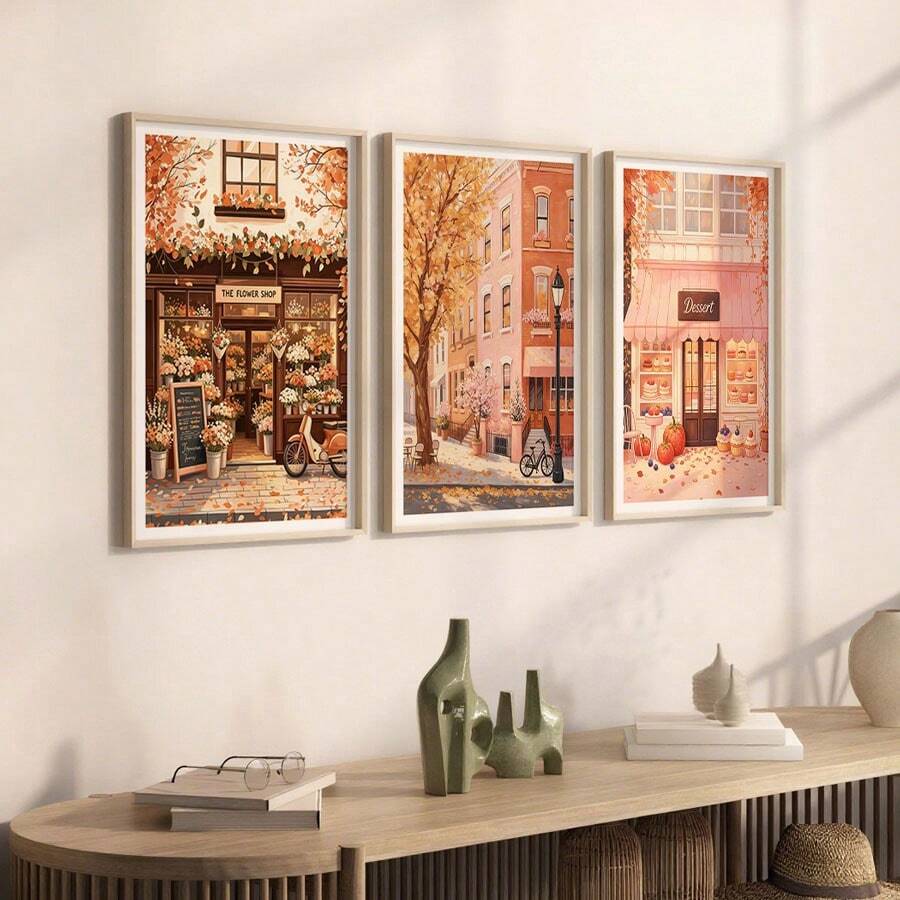 Cozy three-piece storefront art above pale wood console