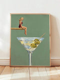 Retro dirty martini illustration with swimmer, olive-filled glass and muted sage background