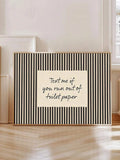 Black striped Text me if you run out of toilet paper poster leaning against wall