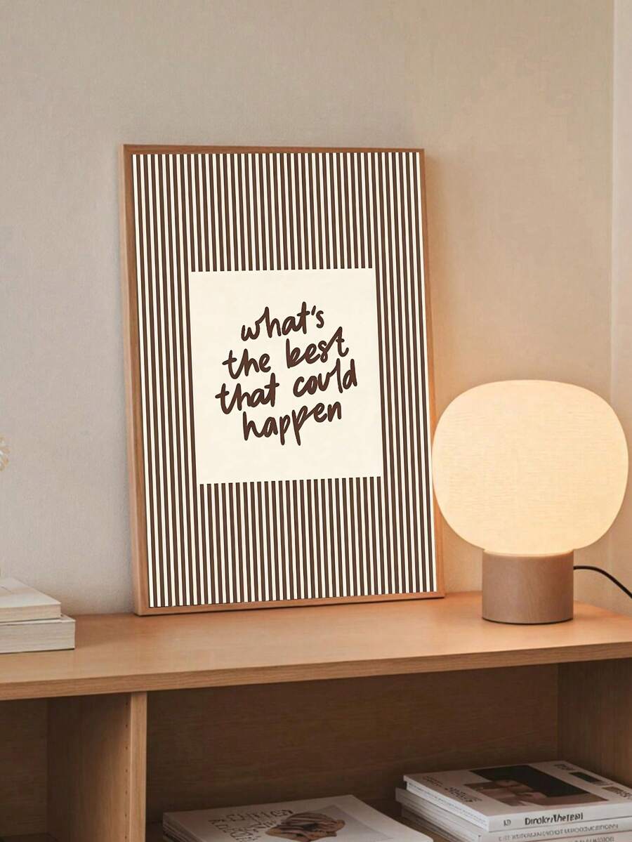 Brown striped Whats the best that could happen poster on console beside globe lamp