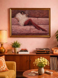 Gold-framed pink sofa fashion artwork on pink wall above retro sideboard