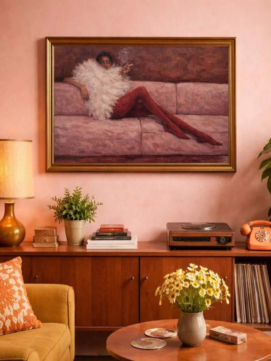 Gold-framed pink sofa fashion artwork on pink wall above retro sideboard