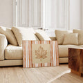 Cozy autumn canvas print displayed beside cream living room sofa