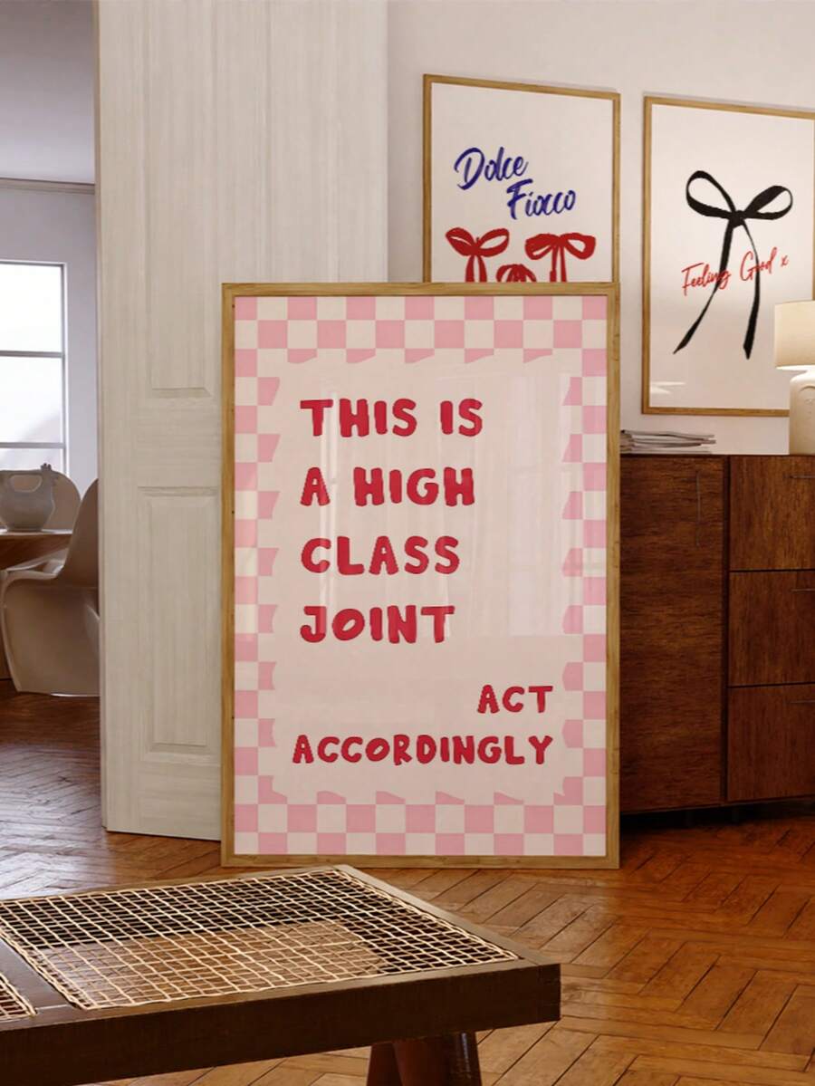 High class joint typography print leaning beside wood cabinet in layered living room decor