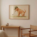 Framed golden retriever golf artwork beside a sofa