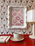 Coquette kiss marks wall art above red vanity desk