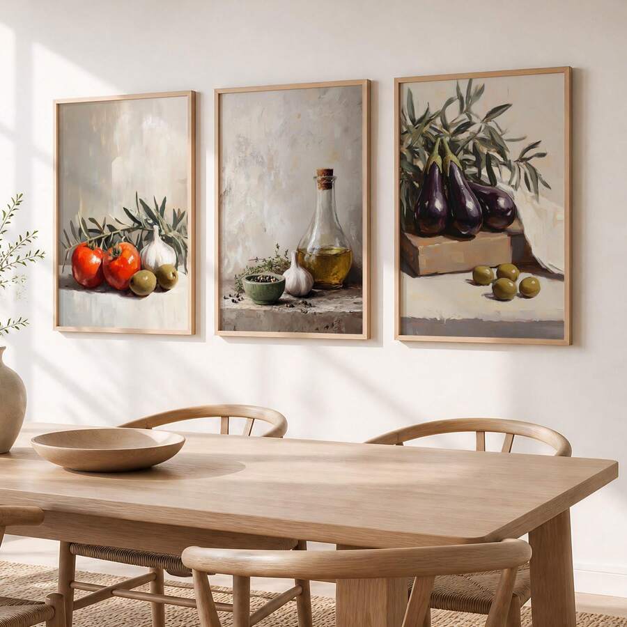 Three vegetable still life prints displayed above dining table