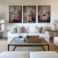 Ghost and black cat triptych above white living room sofa