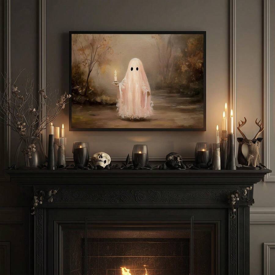 Black framed ghost candle print above a Halloween mantel with skulls and candles