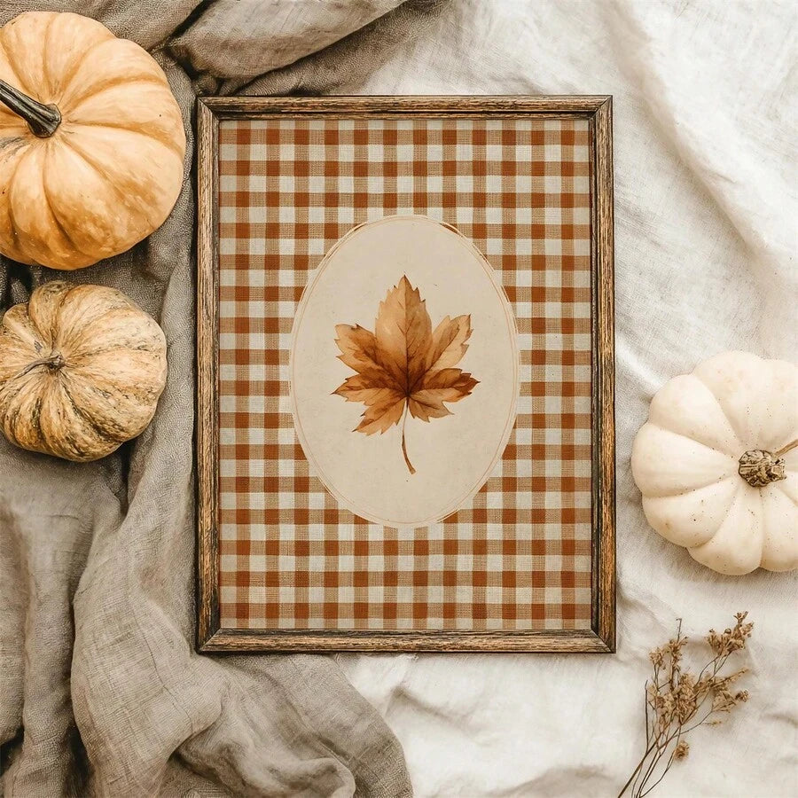 Gingham autumn leaf print displayed with pumpkins and neutral harvest textiles
