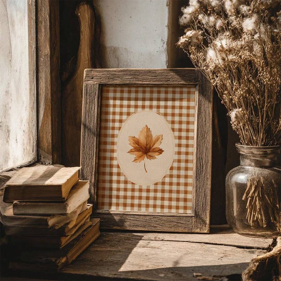 Rustic autumn botanical wall art beside aged books and dried flowers on a windowsill