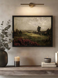 Moody pastoral landscape displayed in black frame under picture light