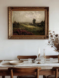 Vintage countryside landscape shown in ornate antique gold frame