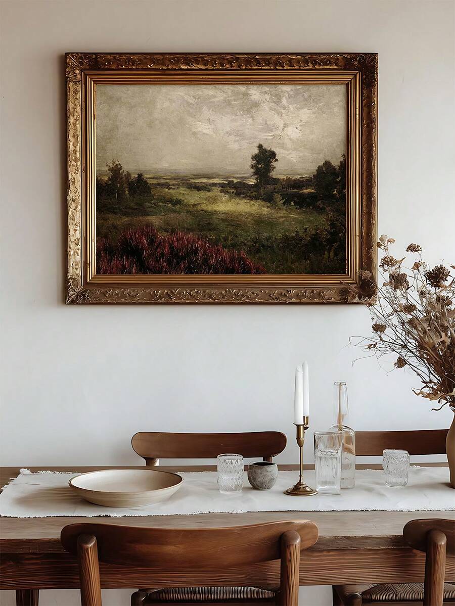 Vintage countryside landscape shown in ornate antique gold frame