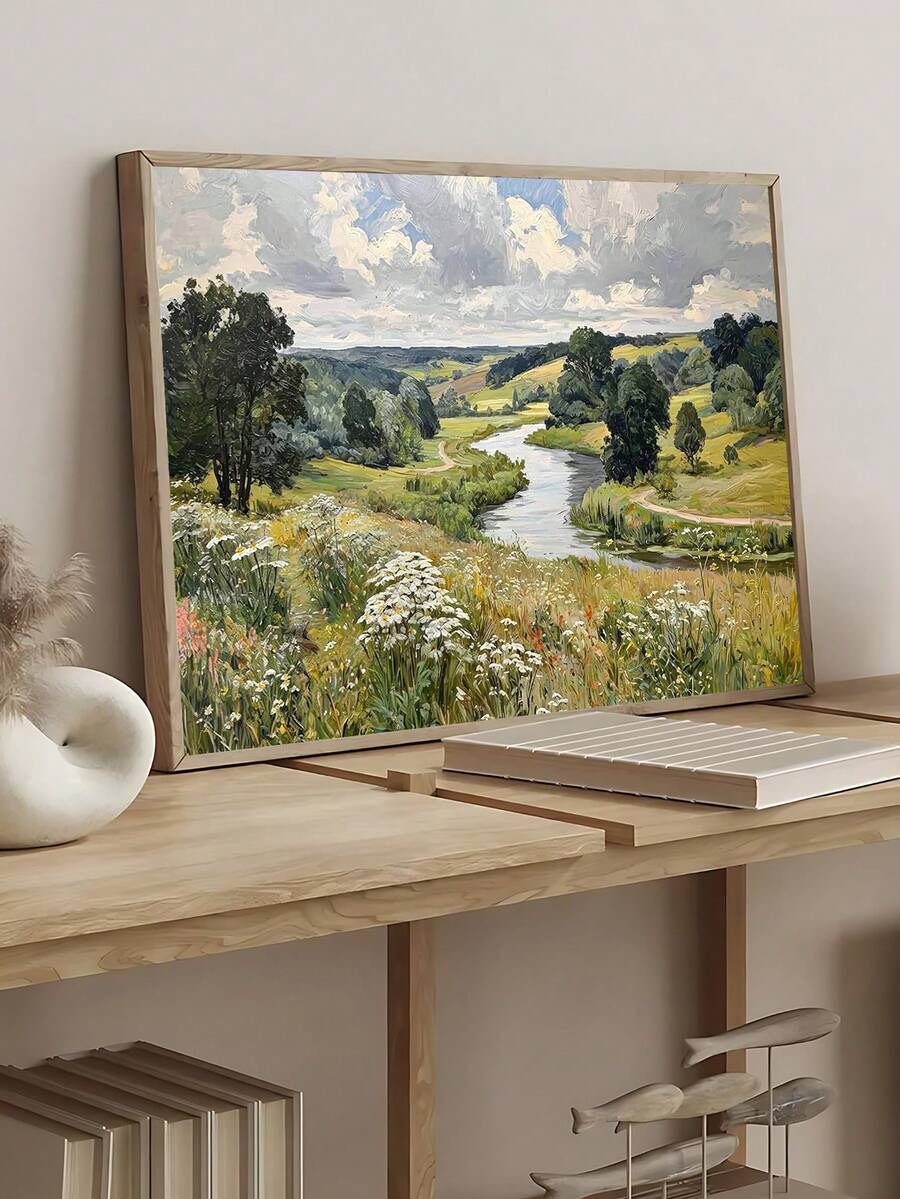 River valley landscape in natural wood frame leaning on desk