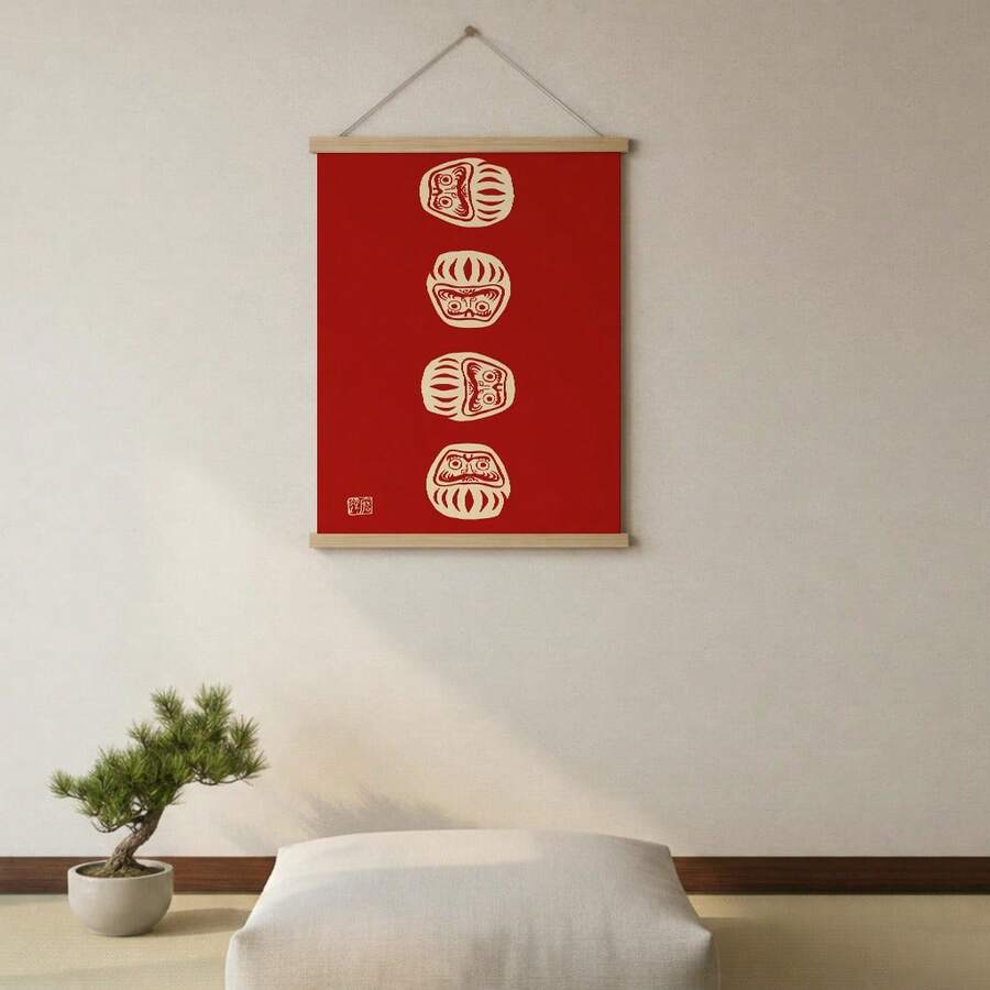 Red and cream Daruma canvas hanging in a neutral bedroom beside a chair