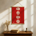 Daruma wall poster above a bed with bonsai accent