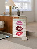 Pink and red kisses wall art displayed in bright modern living room