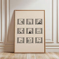 Wood-framed ivory window-vignette print against an ornate white paneled wall