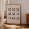 Large framed nine-window illustration in a sunlit neutral room beside a wood cabinet