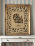 Carved gold framed turkey and autumn leaf print on distressed console