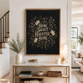 Large framed ghost quote wall art above a console near a staircase