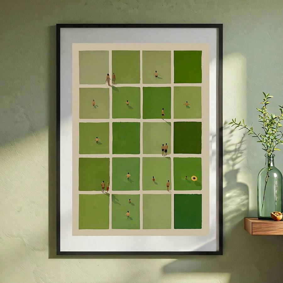 Black framed green grid print on a sage wall beside a glass vase