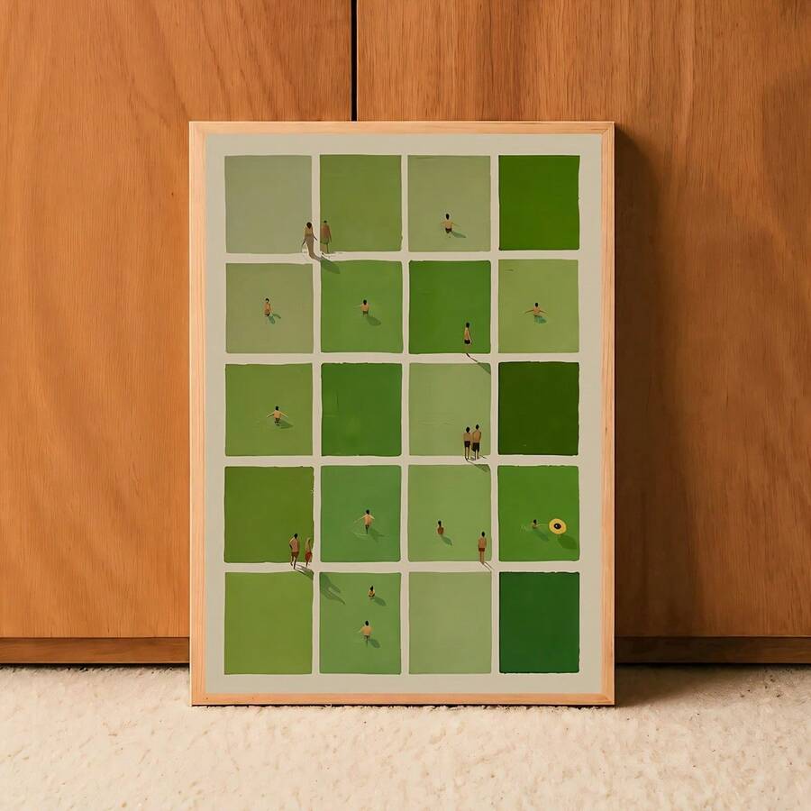Light wood framed green tile artwork leaning against a wood-paneled wall