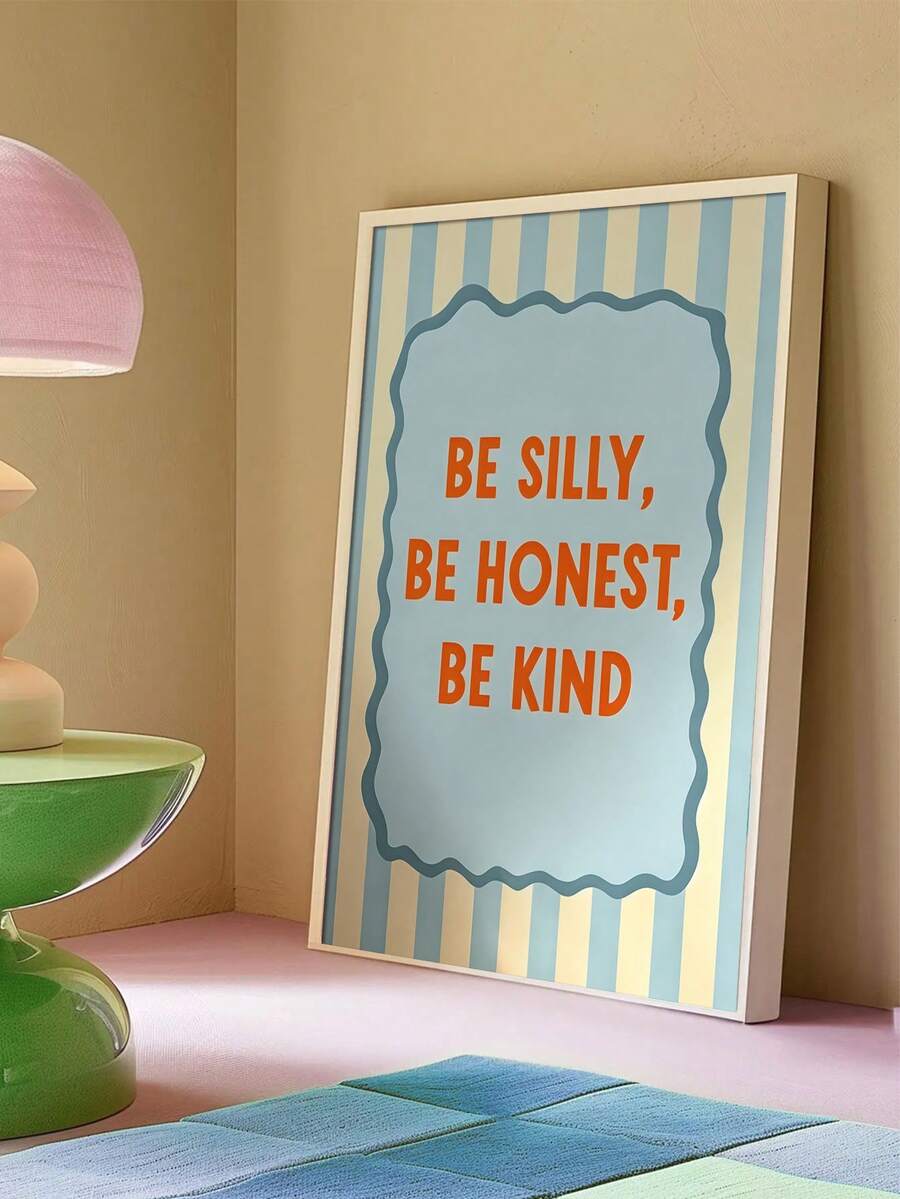 Be Silly Be Honest Be Kind kids quote wall art in a light frame styled on a bedside shelf