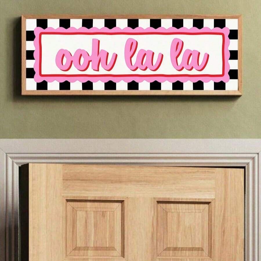Pink ooh la la checkerboard canvas artwork above interior doorway