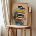 Colorful book stack artwork in light wood frame on chair