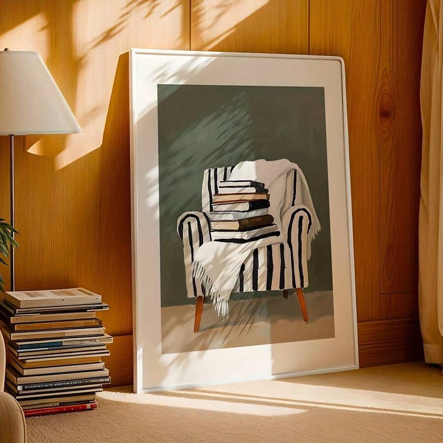 White-framed armchair-and-books artwork in sunlit wood-paneled room beside stacked books
