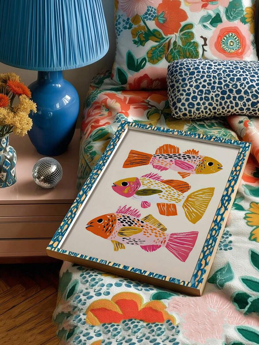 Three illustrated fish in a blue patterned frame on a floral armchair