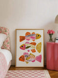 Framed whimsical fish canvas print beside a floral bed and pink nightstand