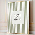 Close view of gold-tone framed coffee please wall print with cream stripes