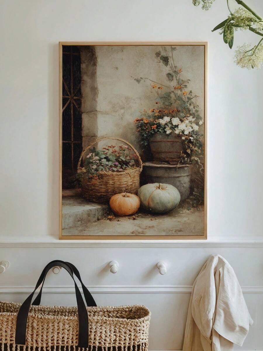 Natural wood framed flower and pumpkin art above entryway wall hooks