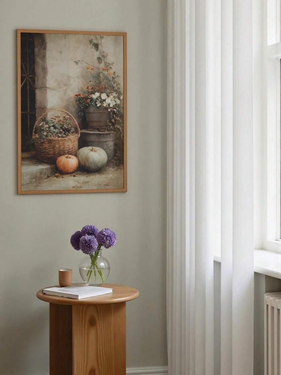 Framed autumn pumpkin still life beside white curtains and a round table