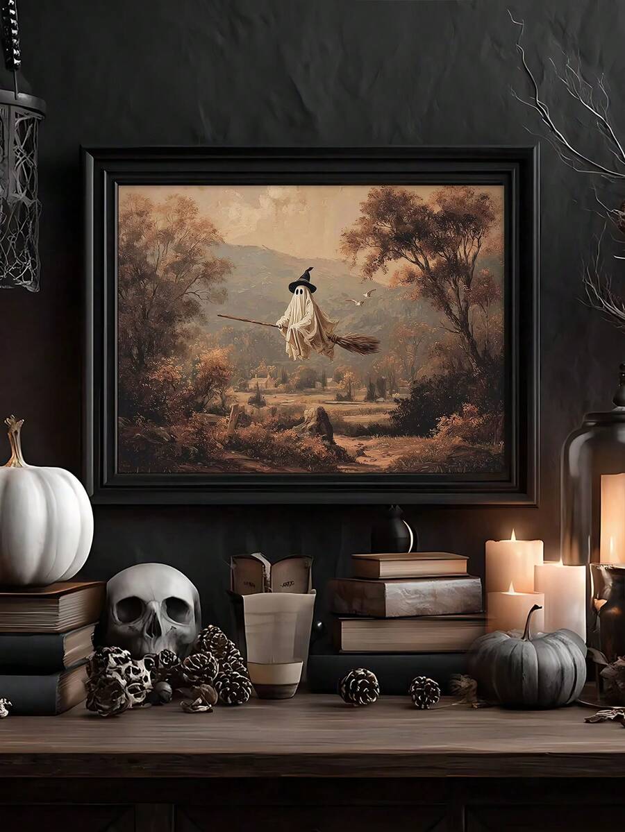 Framed flying ghost witch artwork with pumpkins skull and candles