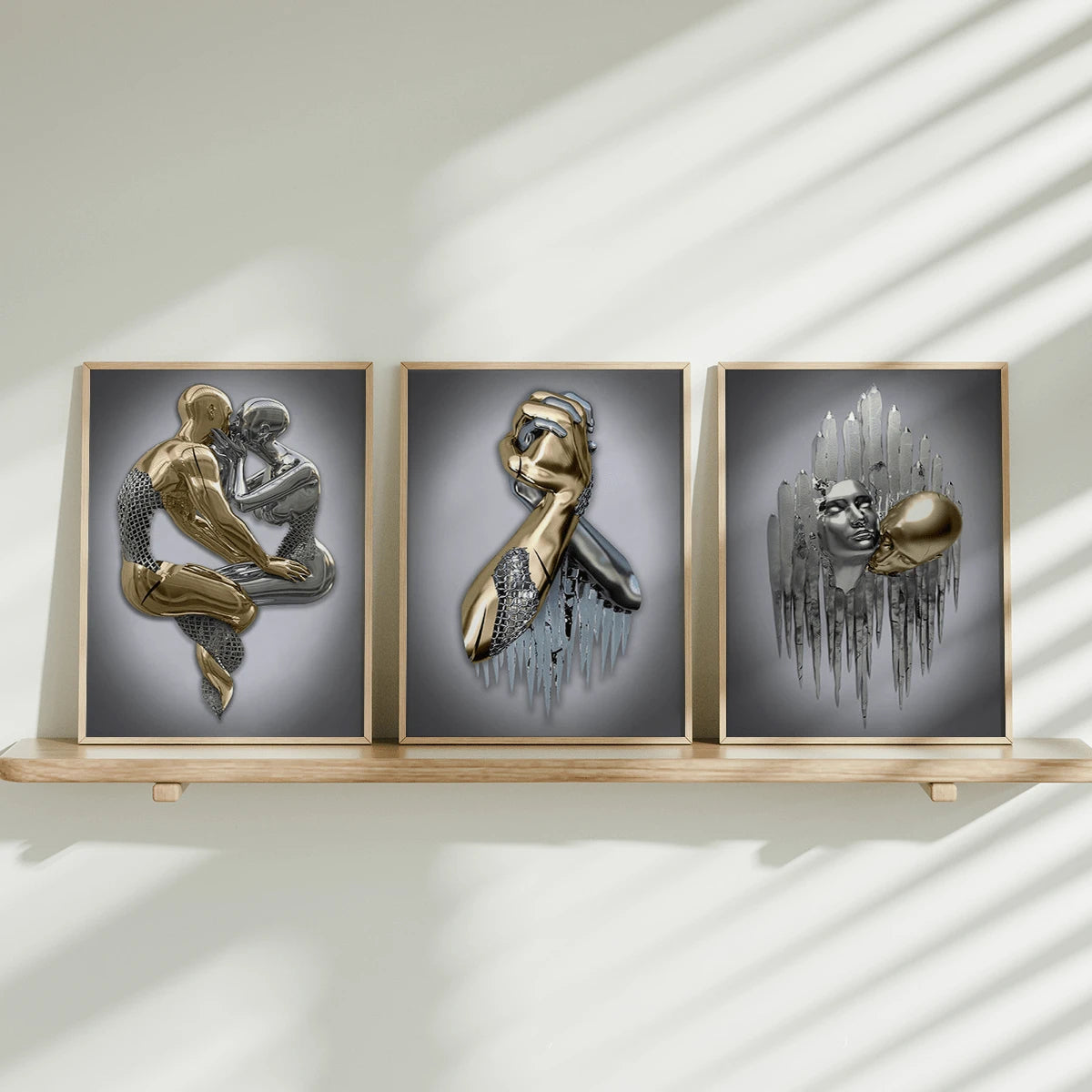 Three gold-framed gold-and-silver figurative prints displayed on slim wood shelf