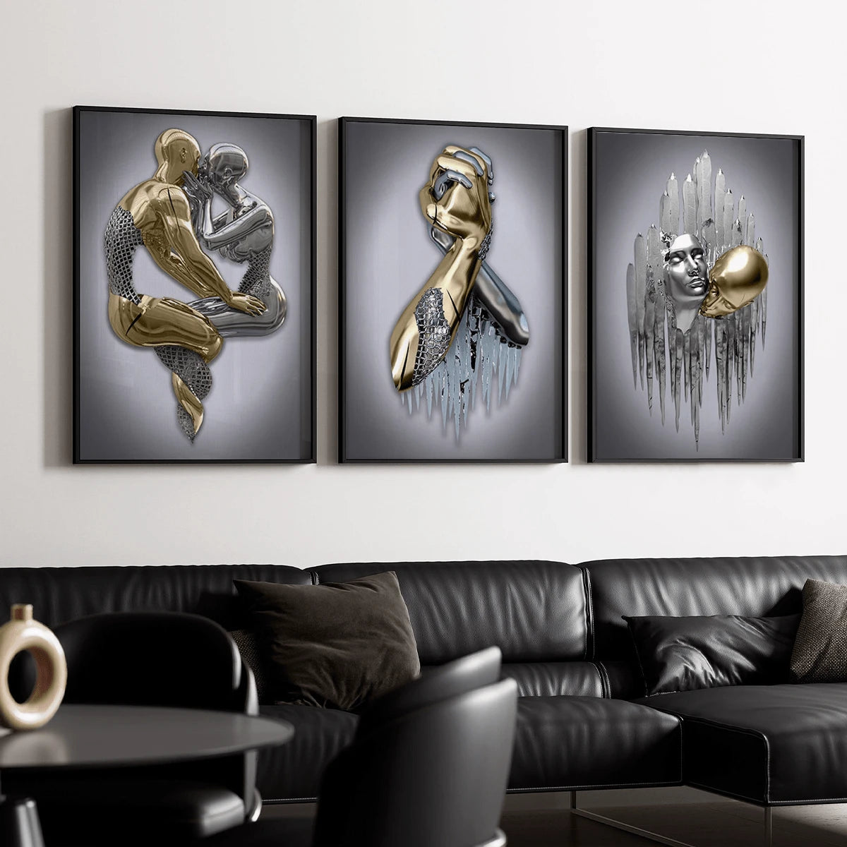 Three black-framed metallic-effect figure artworks above black sectional in modern living room