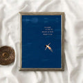 Vertical navy quote print with floating woman in a weathered wood frame and fabric backdrop