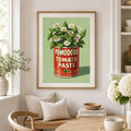 Matted Pomodoro tomato and daisy wall art above a dining nook bench