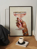 Black-framed cocktail hand illustration leaning above coffee and a styling book