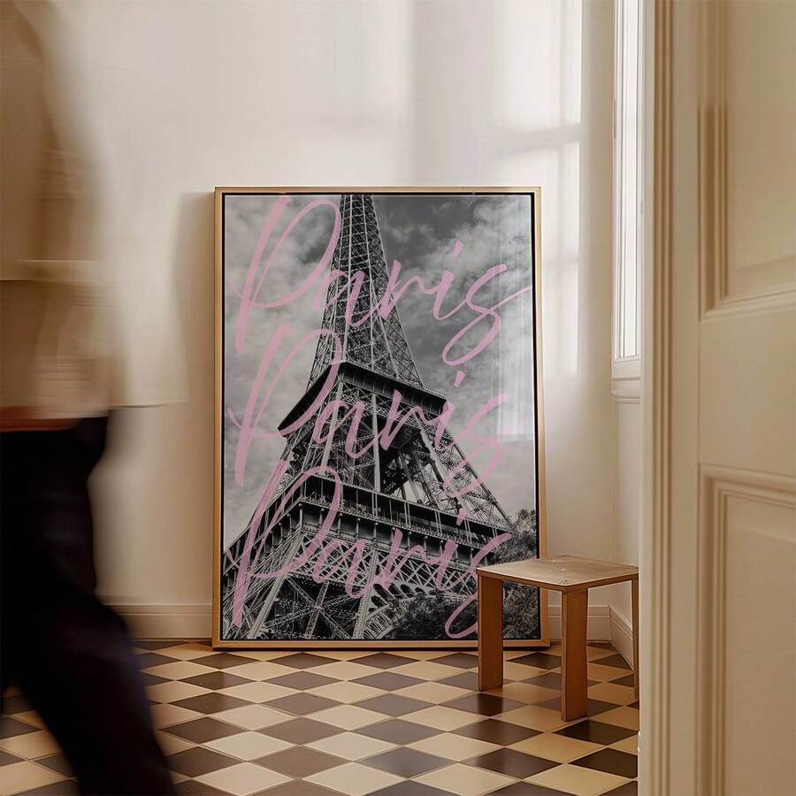 Framed Eiffel Tower print with pink Paris lettering in a checkerboard-floor interior